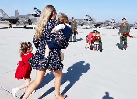 Photo Gallery: Family and U.S. Navy officials greet return of NAS Lemoore F-35 aviators to Lemoore from first sea deployment Families rush to see their husbands and fathers.